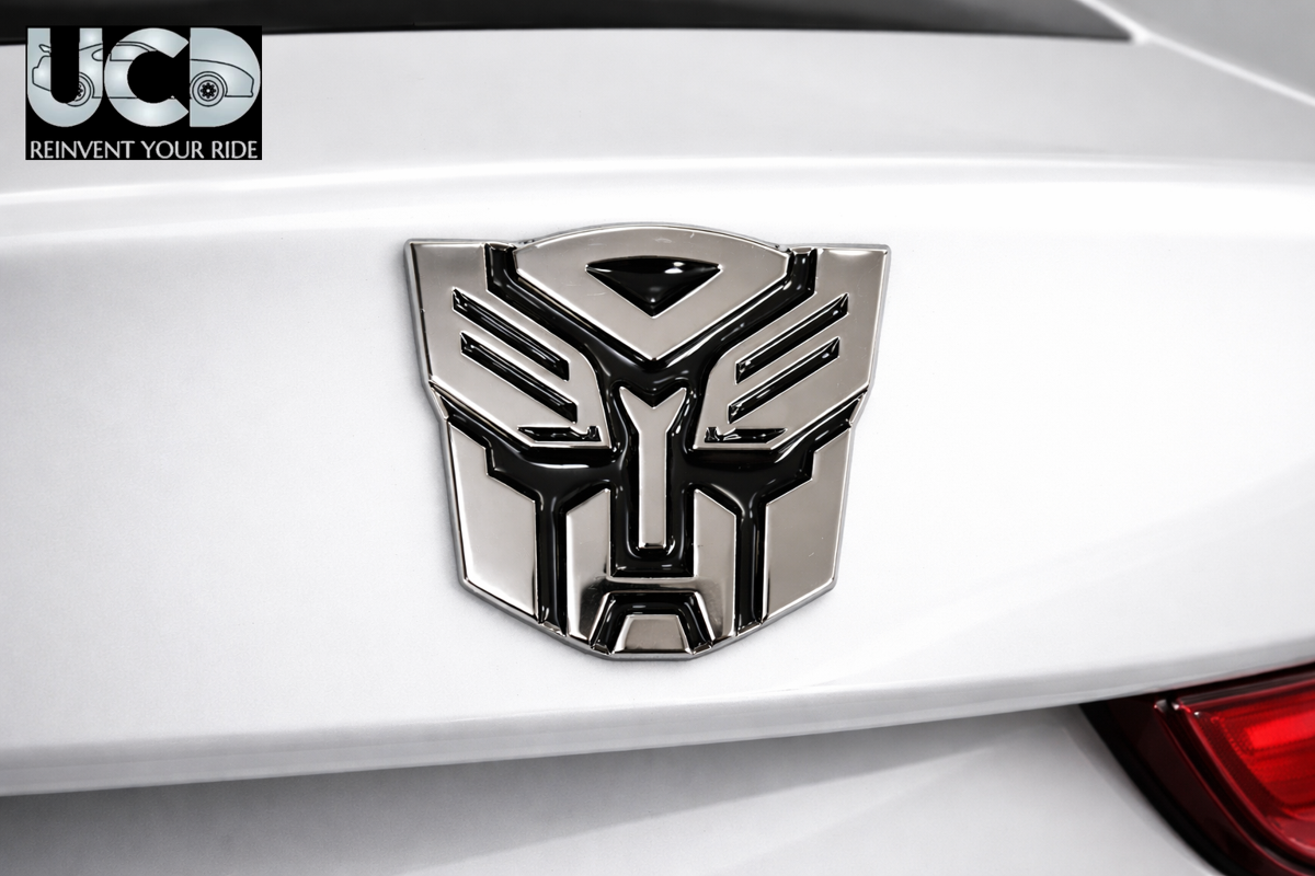 Urban Car Decor 3D Metal Transformer Car Badge Emblem Sticker | Aluminum Alloy Chrome Autobot Logo Decal | Self-Adhesive Car & Bike Exterior Decoration | Premium Metallic Auto Styling